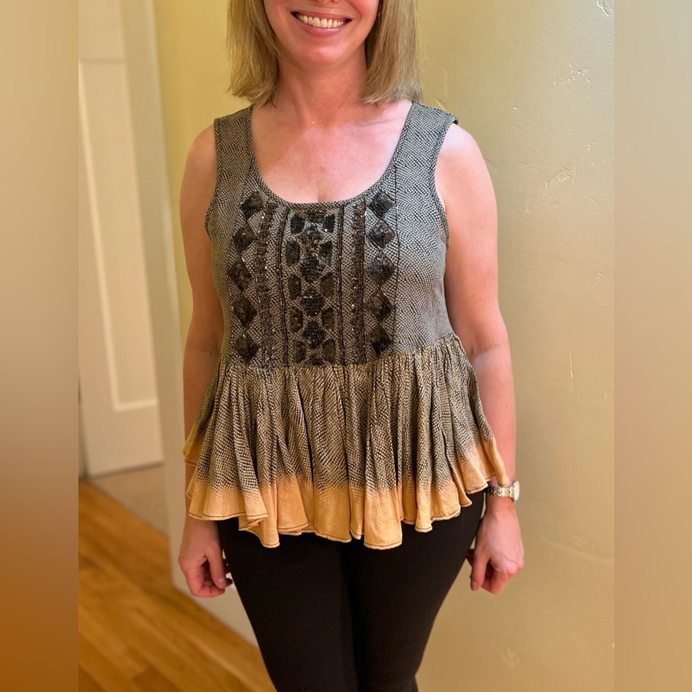 From Anthropologie a beautiful beaded top. Makes an ordinary outfit look special